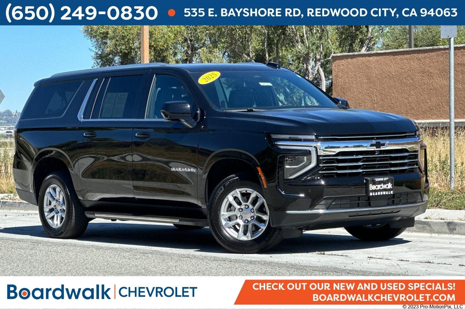 2025 Chevrolet Suburban LT in Black — front three-quarter view