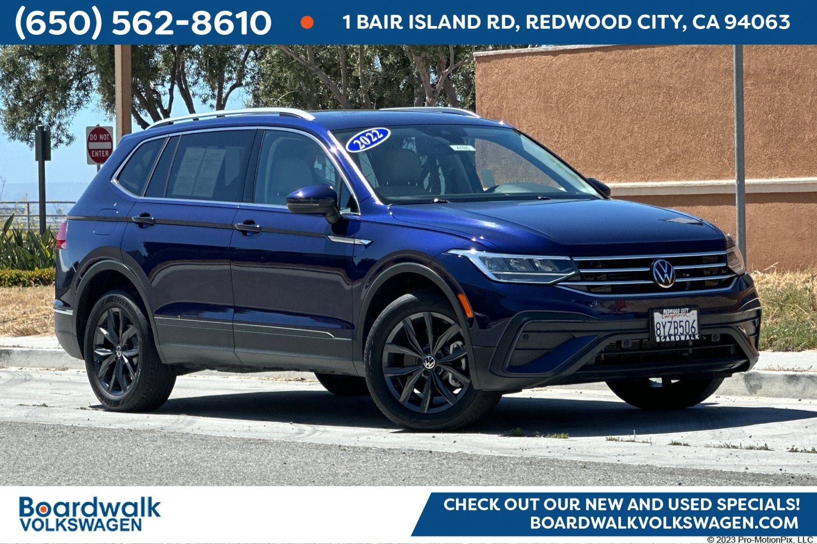 2022 Volkswagen Tiguan 2.0T SE in Atlantic Blue Metallic — front three-quarter view