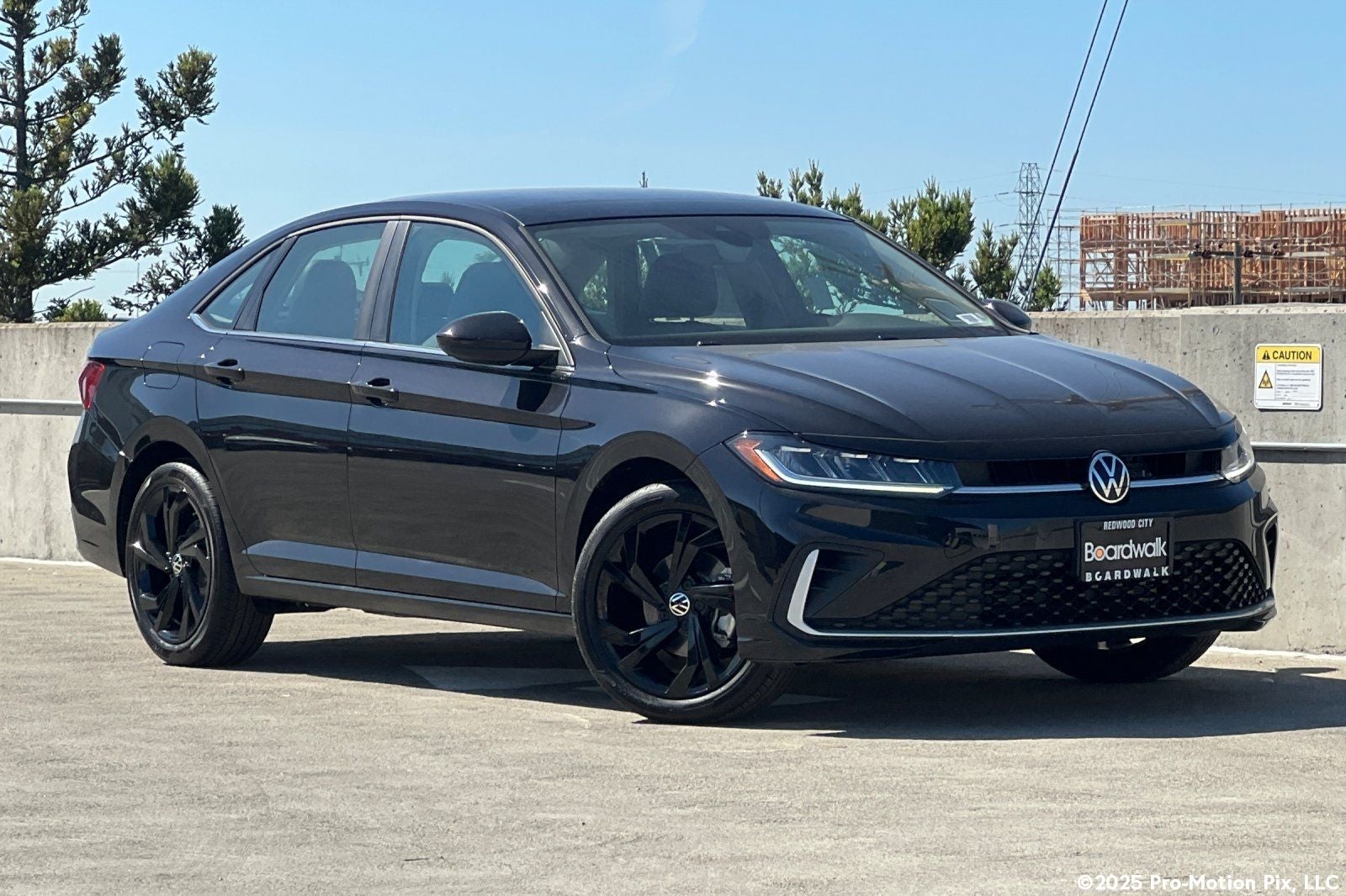 2026 Volkswagen Jetta 1.5T SE in Deep Black Pearl — front three-quarter view
