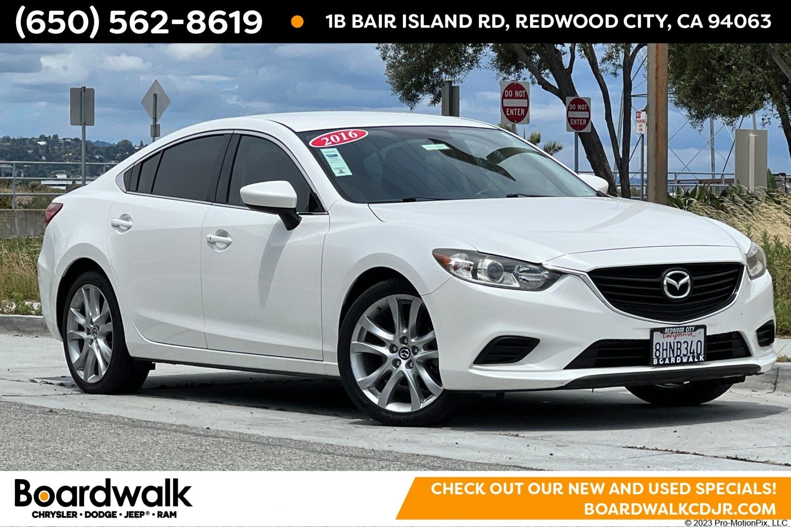 2016 Mazda Mazda6 i Touring in Snowflake White Pearl Mica — front three-quarter view