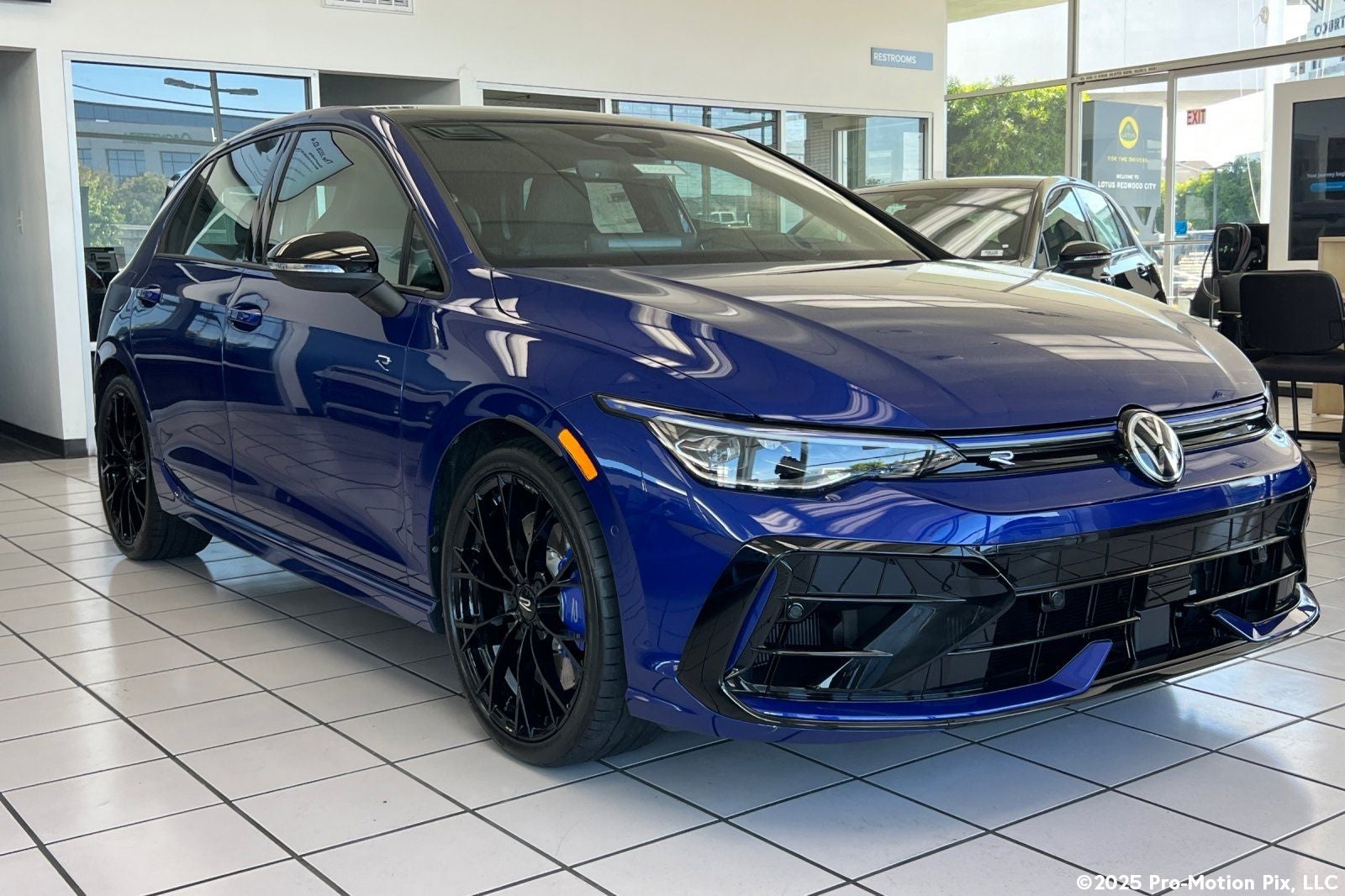 2026 Volkswagen Golf R 2.0T in Lapiz Blue Metallic — front three-quarter view