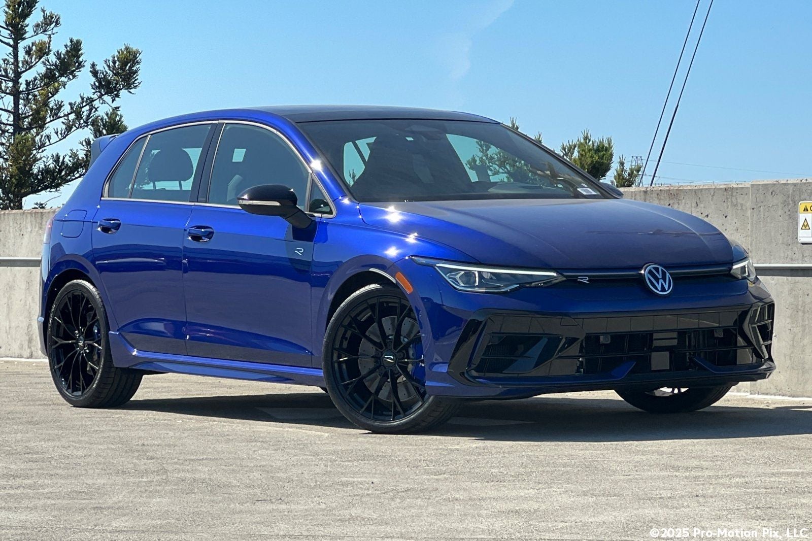 2026 Volkswagen Golf R 2.0T in Lapiz Blue Metallic — front three-quarter view